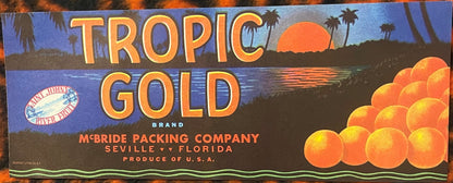 Antique citrus crate label for Tropic Gold brand oranges from McBride Packing Company, Seville Florida, featuring golden oranges, palm trees, sunset, and Saint Johns River logo.