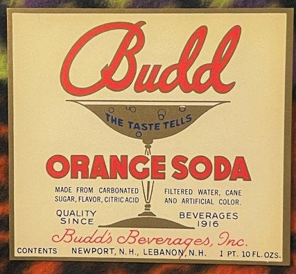 Vintage Budd orange soda label with red script lettering, cream background, and illustration of a drinking glass, from Newpor
