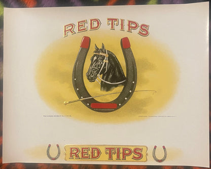 Red Tips embossed cigar label: black horse's head inside a red-tipped horseshoe with a riding crop, RED TIPS above and again on a gold panel between two small horseshoes