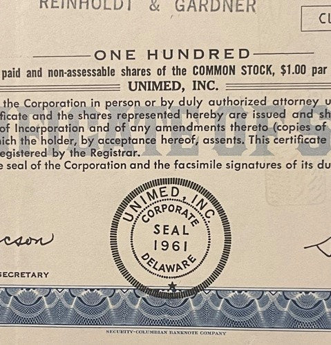 Cream-colored stock certificate for Unimed Inc showing corporate seal, with blue decorative border and text for 10