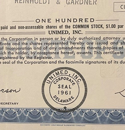 Cream-colored stock certificate for Unimed Inc showing corporate seal, with blue decorative border and text for 10