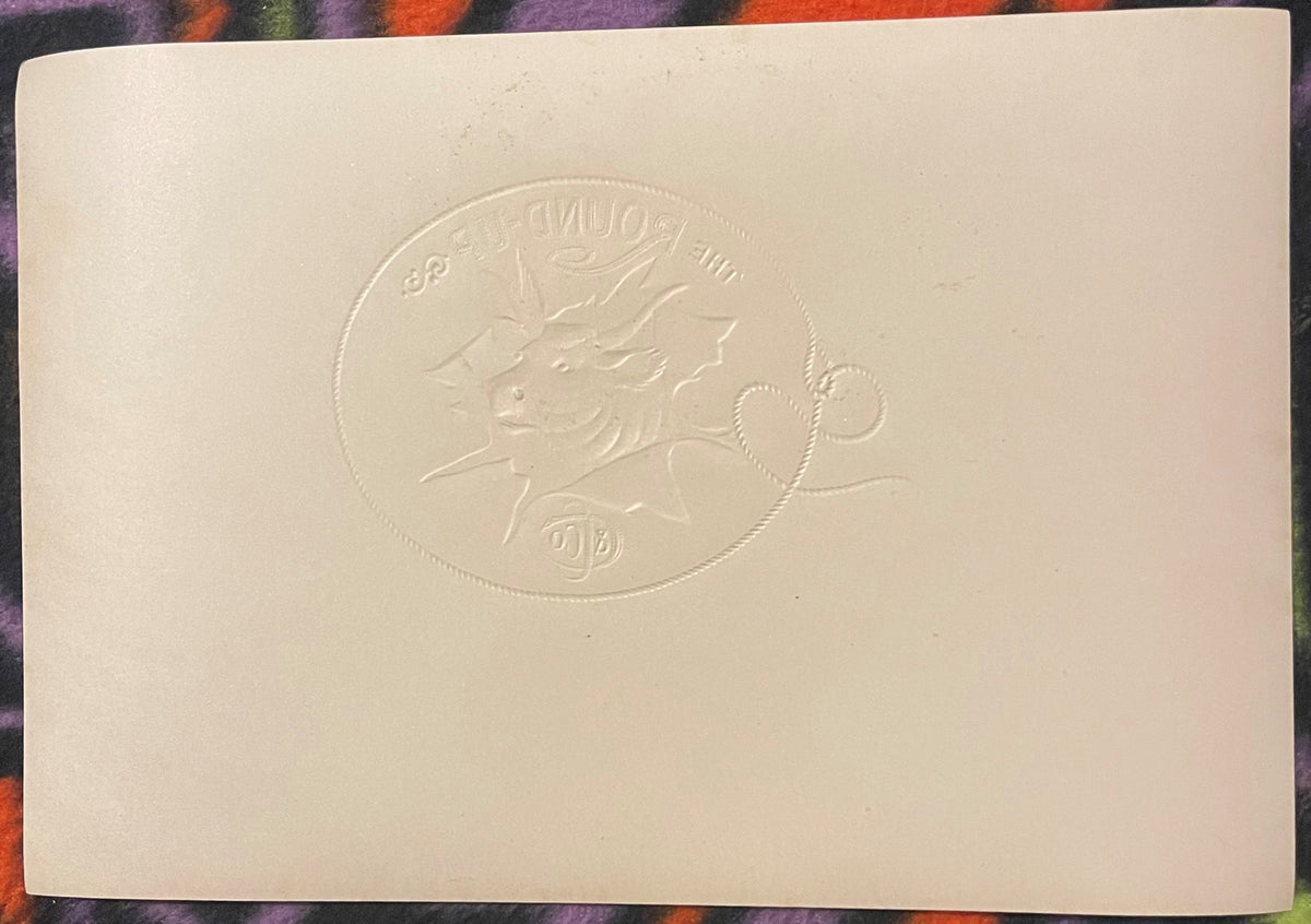 Cream-colored embossed cigar label featuring a bull's head in profile within a circular border, viewed flat