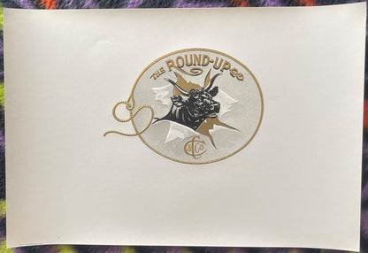 Embossed cigar label featuring a bull's head in a rope circle with "The Round-Up" text and decorative rope border on cream pa