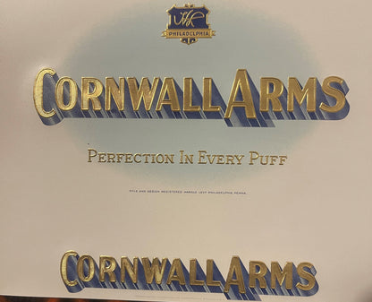 Large cream Cornwall Arms cigar label: the HL shield over PHILADELPHIA, CORNWALL ARMS in raised gold on a pale blue oval, PERFECTION IN EVERY PUFF and the registration line below.