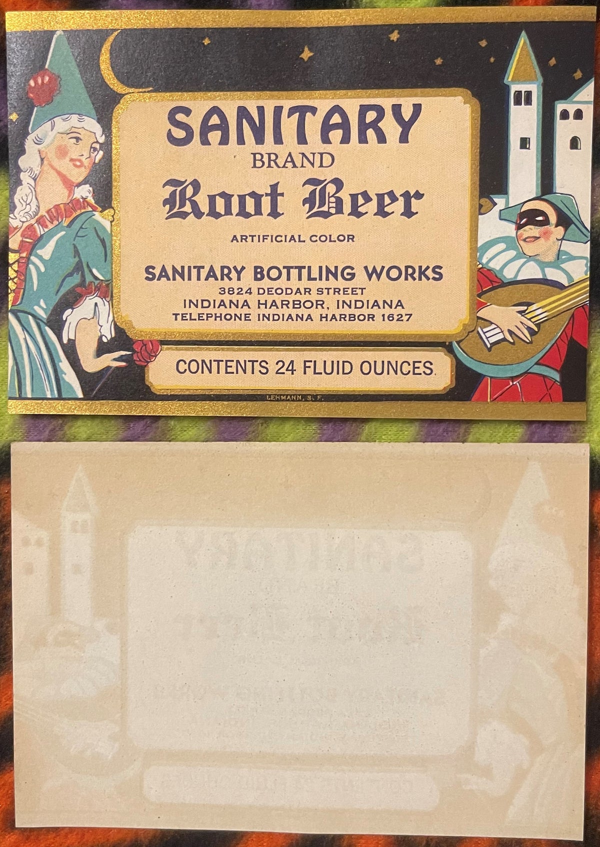 Vintage Sanitary Brand Root Beer label featuring a jester and castle, with address in Indiana Harbor, shown front and back