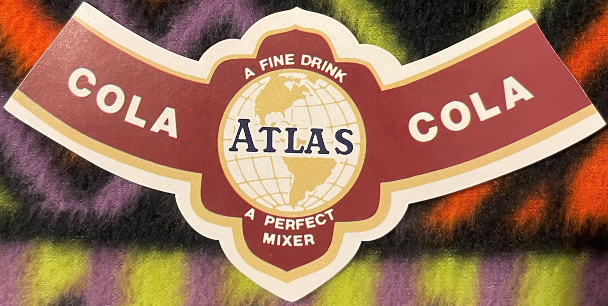 Vintage Atlas Cola label featuring a globe design, white and gold trim, and text reading "A Fine Drink," "A Perfect Mixer,"