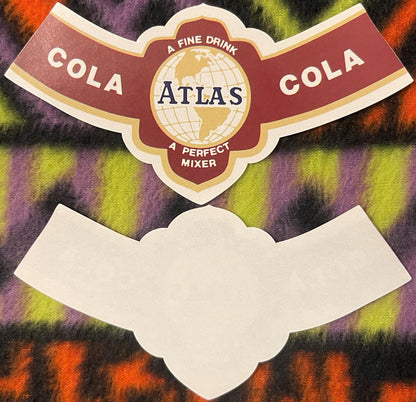 Vintage Atlas Cola label with globe logo, red and cream die-cut shape, "A Fine Drink" and "A Perfect Mixer" text, displayed o
