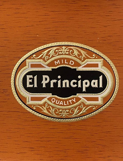 Gold embossed cigar label reading "El Principal" with "Mild" and "Quality" text on wooden surface