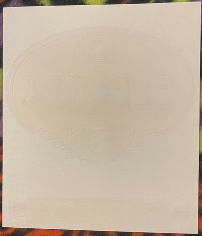Back of the Elektra cigar label: blank textured paper with the oval and lettering embossed through from the front