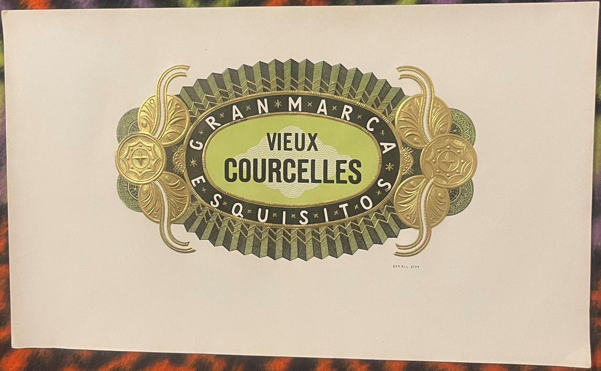 Ornate vintage cigar label with gold and green embossed design reading "Vieux Courcelles" and "Gran Marca" on cream paper.