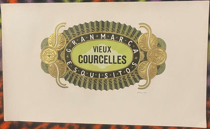Ornate vintage cigar label with gold and green embossed design reading "Vieux Courcelles" and "Gran Marca" on cream paper.