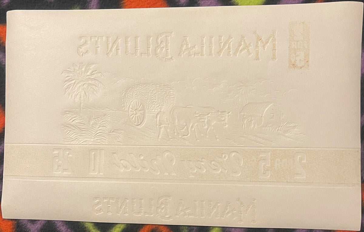 Cream-colored embossed cigar label with "Manila Blunts" text at top and bottom, tropical scene with palm trees and ornate car