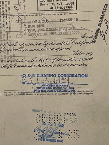 Aged stock certificate from with blue ink stamps and signatures, addressed to CEDE & CO in New York, featuring R&R Clear