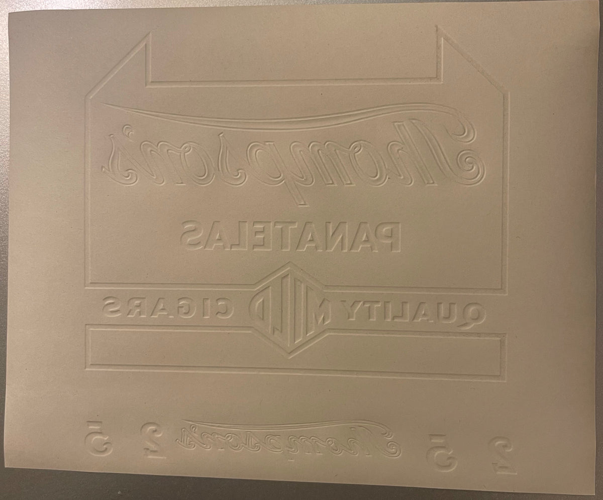 Cream-colored embossed cigar label with ornate decorative borders and text reading "Thompson's" and "Plantation" in relief