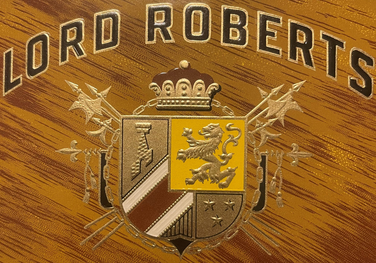 Gold-embossed cigar label reading "LORD ROBERTS" with heraldic coat of arms featuring a yellow lion on wood grain background
