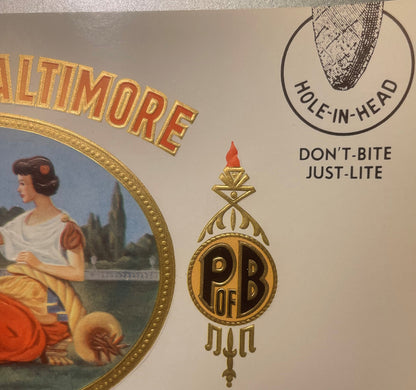 Antique cigar label with gold foil embossing showing "Baltimore" text, classical woman portrait in oval frame, ornate "PB" cr
