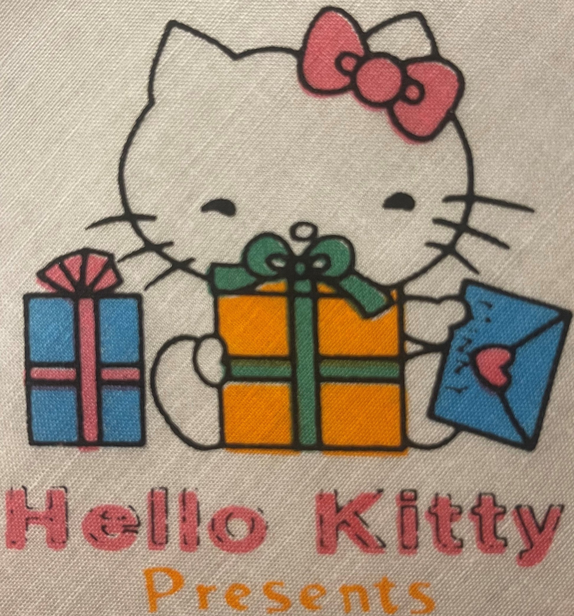 Vintage Hello Kitty cotton napkin with character surrounded by colorful gift boxes, pink bow, and "Hello Kitty Presents" text