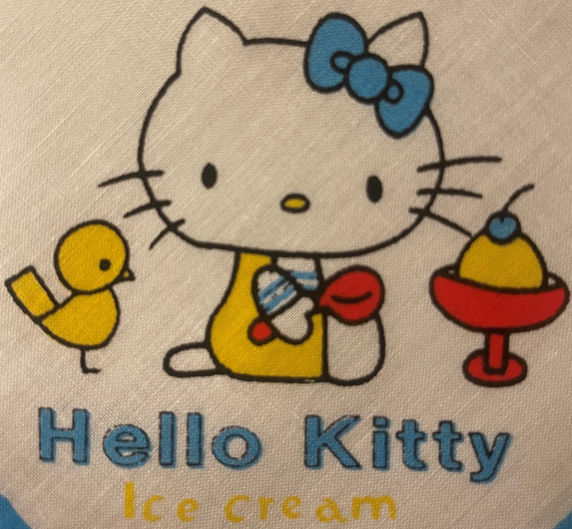 Vintage Hello Kitty cotton napkin with blue bow, yellow duck toys, and ice cream cone designs on beige fabric