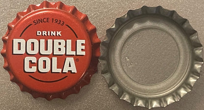 Red and silver bottle caps shown front and back, red cap printed "Since 1933 Drink Double Cola" with registered trademark sym