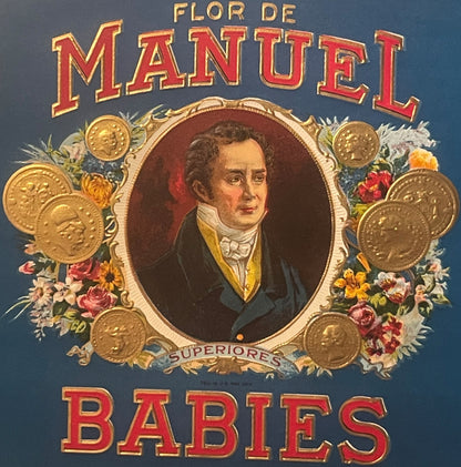 Vintage cigar label with gold-embossed text "Flor De Manuel Babies," portrait of a man in formal dress surrounded by gold coi