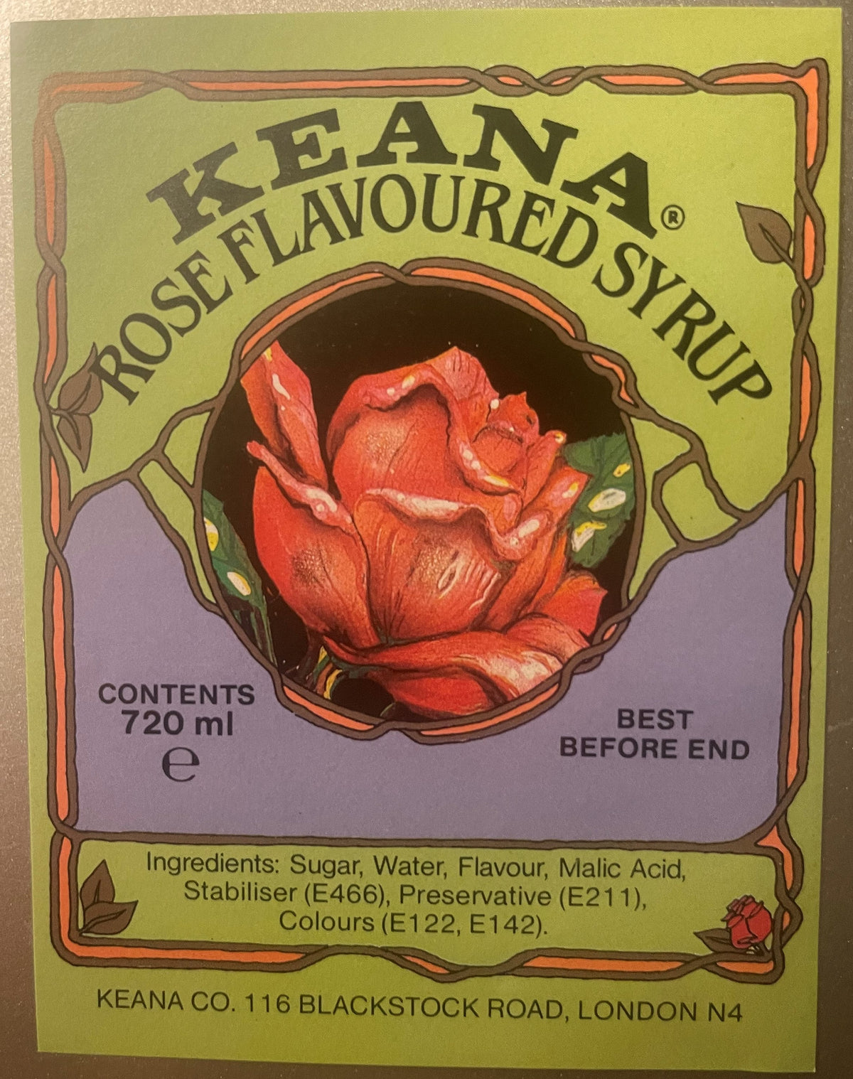 Vintage Keana rose-flavored syrup label, 720ml, with art nouveau border, red rose illustration, and ingredients list