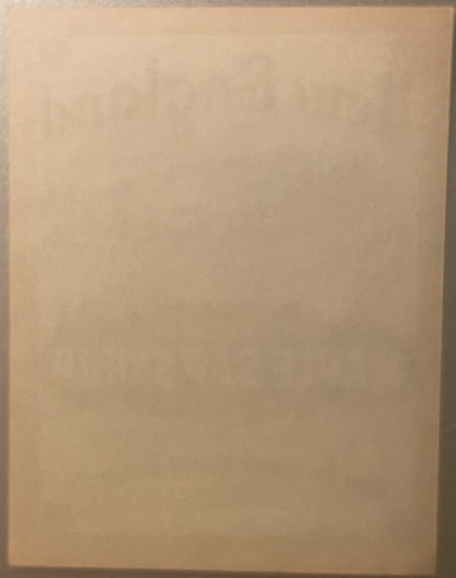 Blank cream-colored vintage label with subtle aging, photographed flat against plain background
