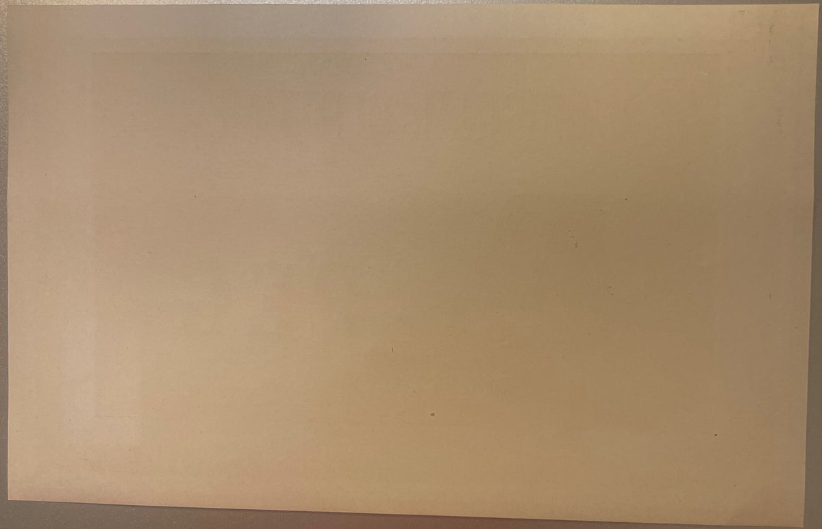 Blank cream-colored vintage cigar box label with subtle printing, photographed flat against neutral background