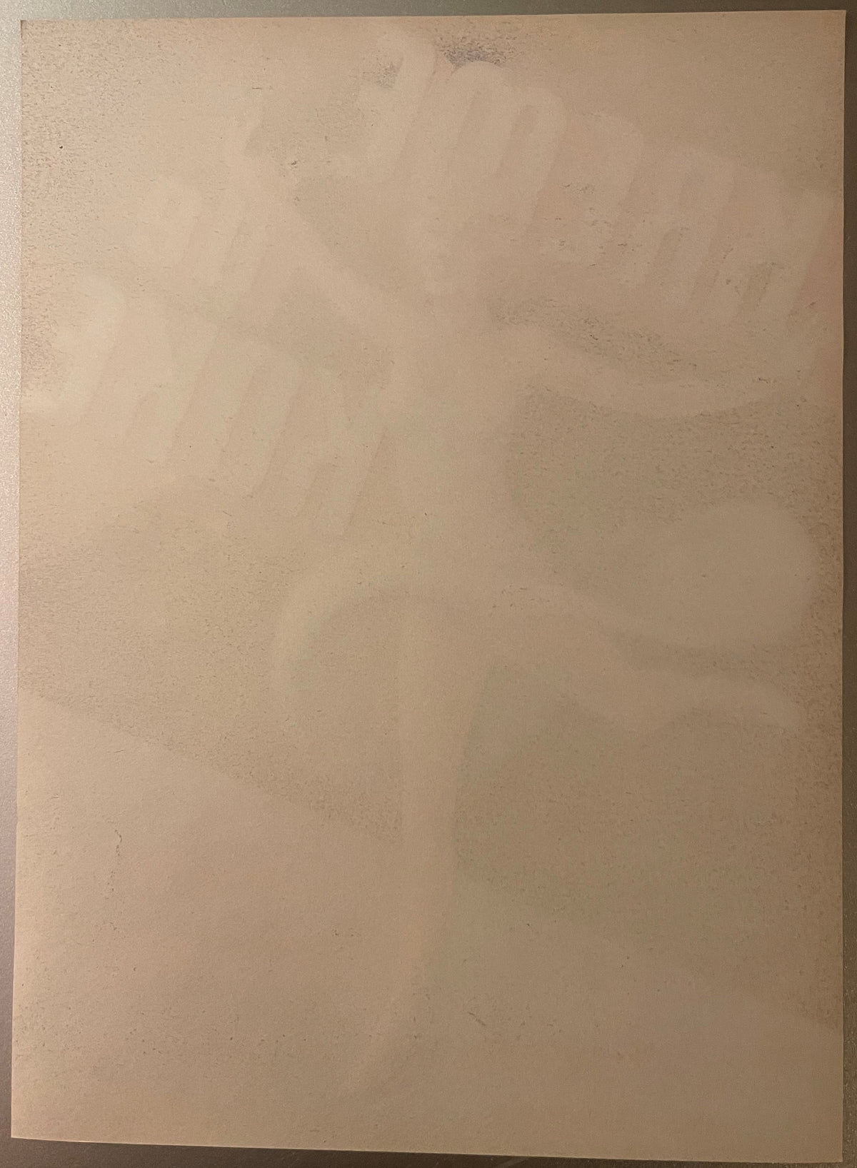 Blank cream-colored vintage produce label with subtle wear marks and discoloration across surface