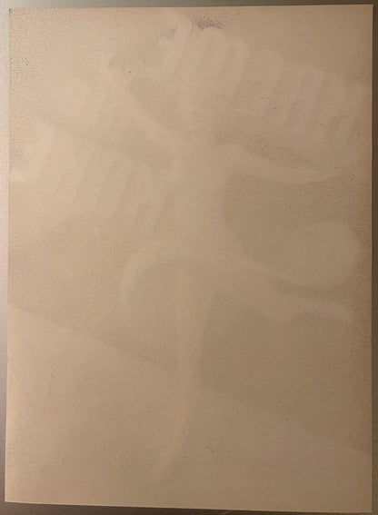 Blank cream-colored vintage produce label with subtle wear marks and discoloration across surface
