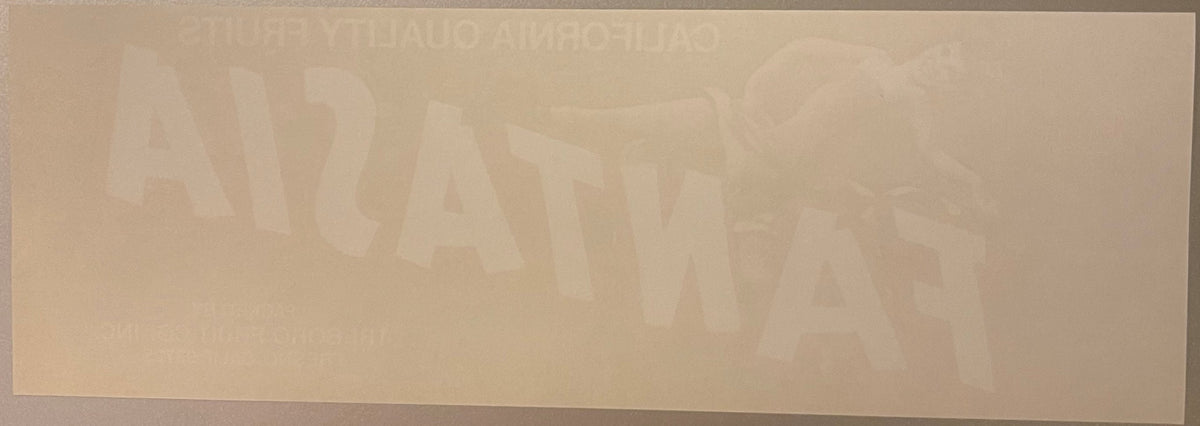 Faded vintage Fantasia fruit crate label with tan and cream colors, text barely visible against light background