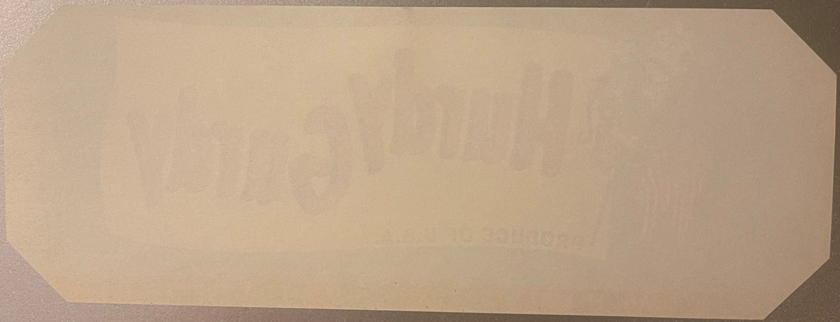 Blank cream-colored vintage crate label with rounded corners, displayed flat against gray surface
