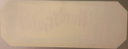 Blank cream-colored vintage crate label with rounded corners, displayed flat against gray surface