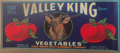 Vintage produce crate label featuring a deer head centered between red tomatoes on dark blue background, gold lettering readi