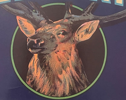 Vintage vegetable crate label featuring an elk stag head with antlers in orange and brown tones on dark blue background with 