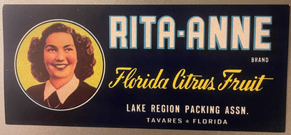 Vintage Rita-Anne brand Florida citrus fruit crate label featuring a woman's portrait in yellow circle on dark blue