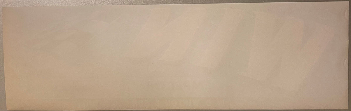 Blank cream-colored vintage fruit crate label with minimal visible printing, photographed flat against neutral background
