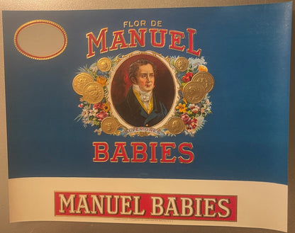 Vintage cigar label with blue background featuring portrait of man in oval frame surrounded by gold coins and flowers, text r