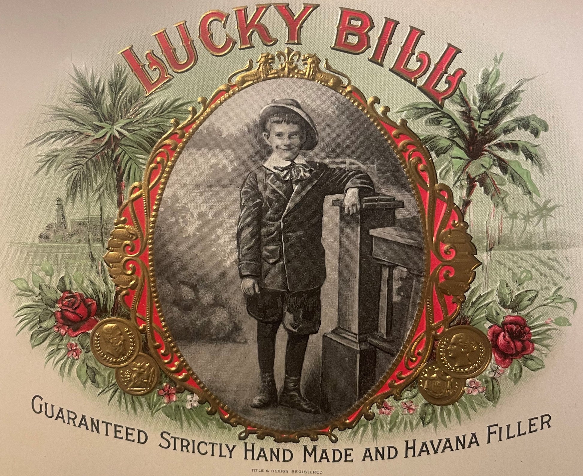 Ornate gold-embossed cigar label featuring "Lucky Bill" text, Victorian boy in formal attire with hat leaning on desk, surrou