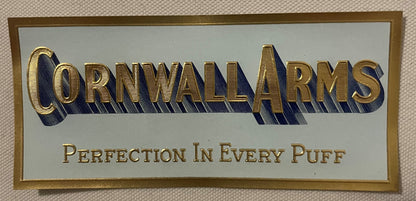 Antique Cornwall Arms small cigar label: CORNWALL ARMS in raised gold capitals with a blue shadow and PERFECTION IN EVERY PUFF, inside a gold rule on pale blue-gray.