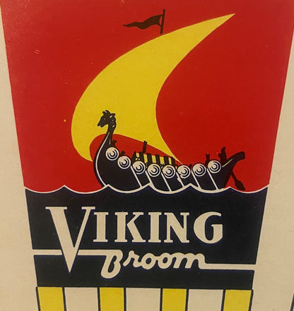Antique 1935 Viking Broom label featuring Art Deco design with black Viking ship, yellow sail, red background, and text on black band against cream paper.