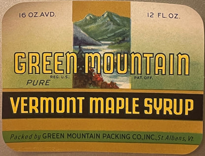 Vintage Green Mountain Vermont Maple Syrup label featuring mountain landscape, yellow text, and brown/green color scheme, St.