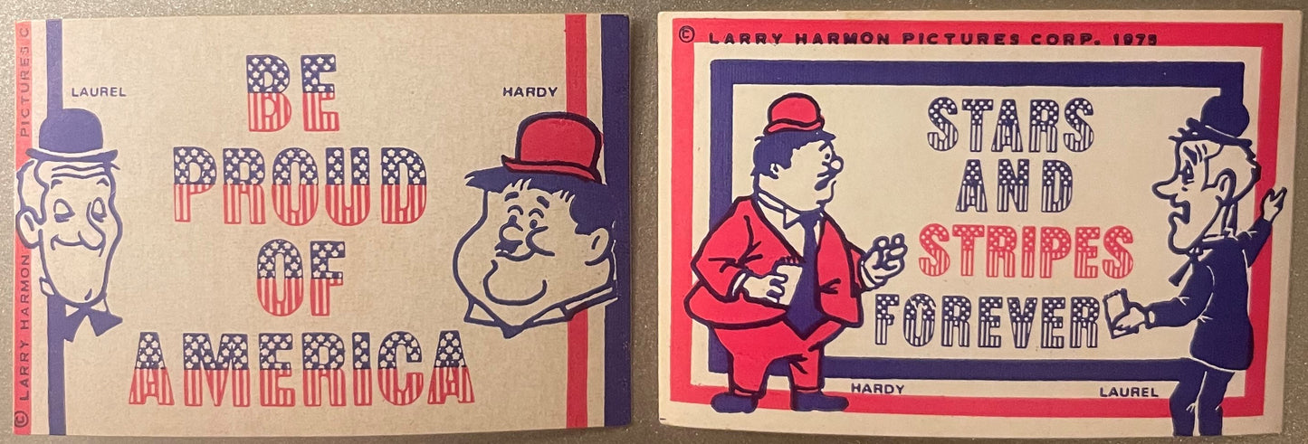Two vintage Laurel and Hardy bicentennial stickers with patriotic red and blue striped lettering and cartoon character illust