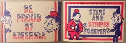 Two vintage Laurel and Hardy bicentennial stickers with patriotic red and blue striped lettering and cartoon character illust