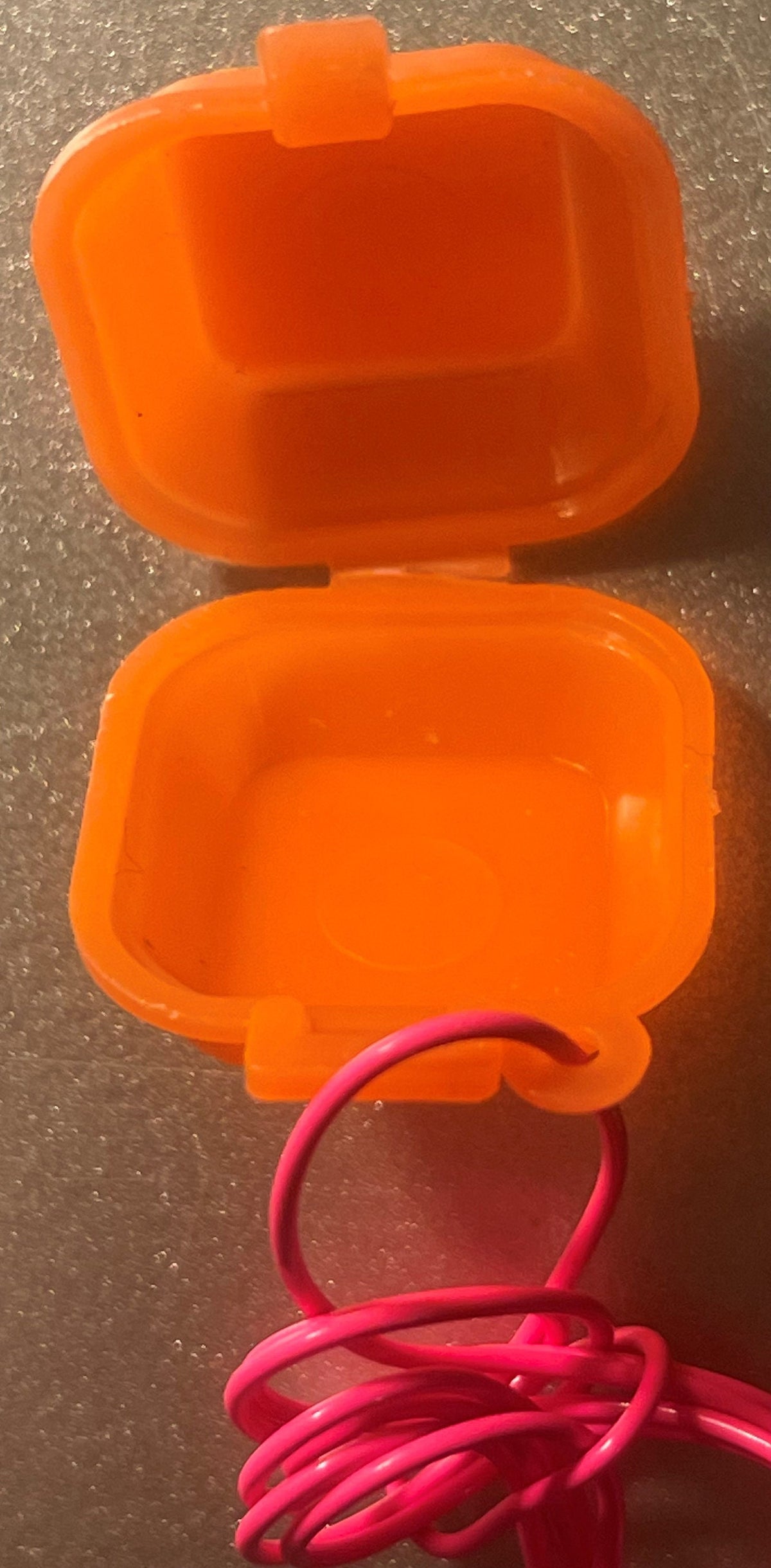 Orange Jumbo Burger charm box opened on its hinge to show the empty lid and base, hot pink cord through the loop