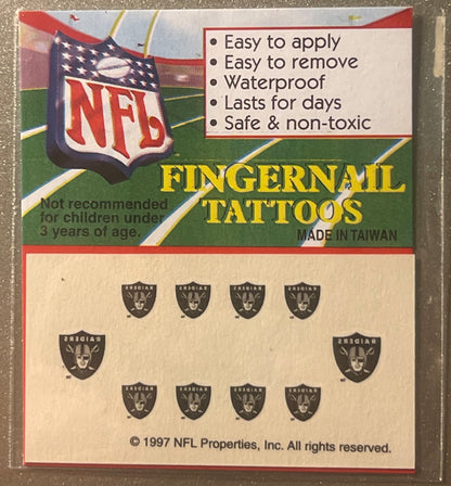 Sealed package of 1997 NFL Oakland Raiders fingernail tattoos showing product card with team logo, feature list, and sheet of