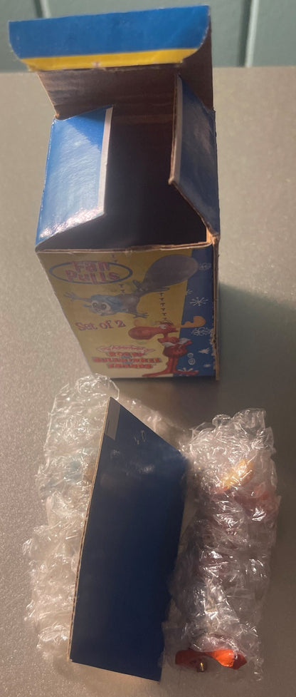 Opened vintage Rocky and Bullwinkle fan pull chain set box with plastic-wrapped moose and squirrel figurine pulls visible ins