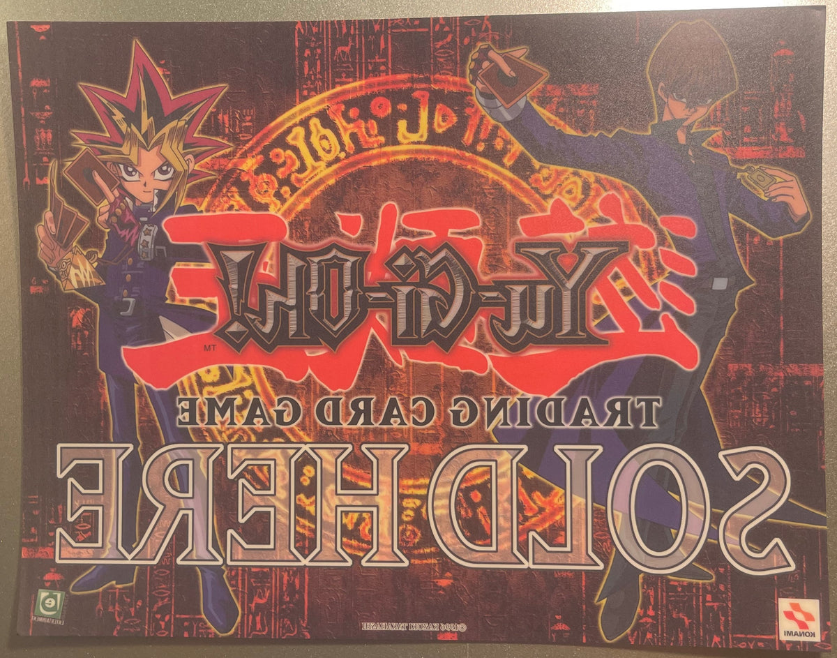 Retro Yu-Gi-Oh! trading card game window cling featuring red metallic text, Yugi character with spiky blonde hair on left