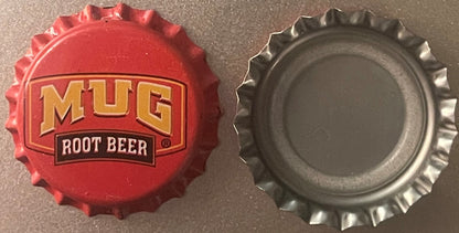 Vintage Mug Root Beer bottle cap showing red embossed front with gold lettering and silver metallic back side, displayed flat