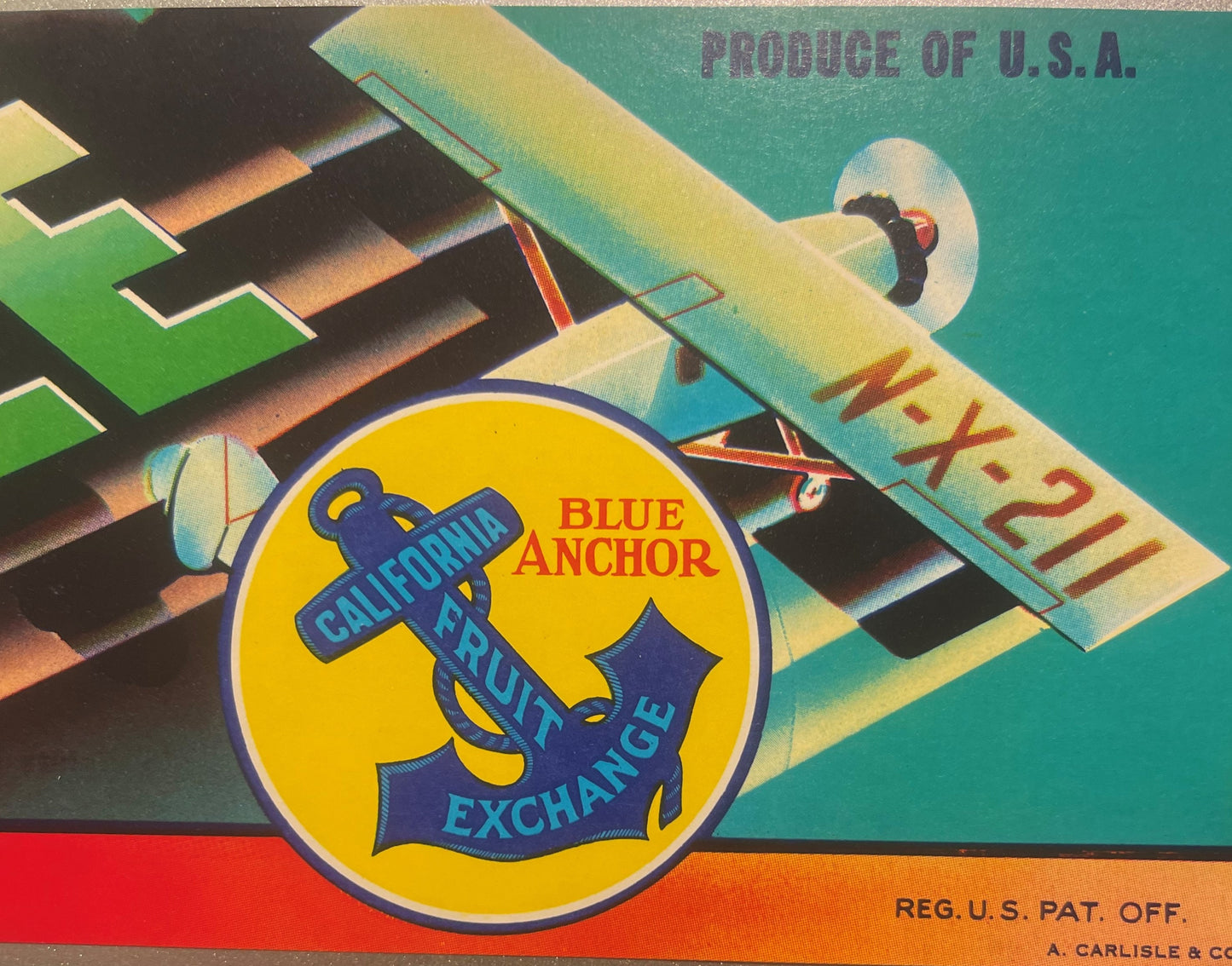 Vintage fruit crate label featuring a blue anchor emblem with "Blue Anchor California Fruit Exchange" text, airplane illustra