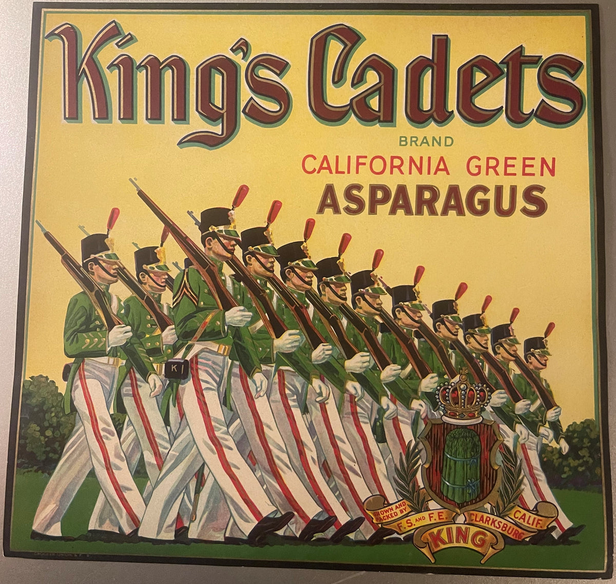 Full King's Cadets California Green Asparagus label with dark border, marching cadets and crowned crest, F.S. and F.E. King ribbon